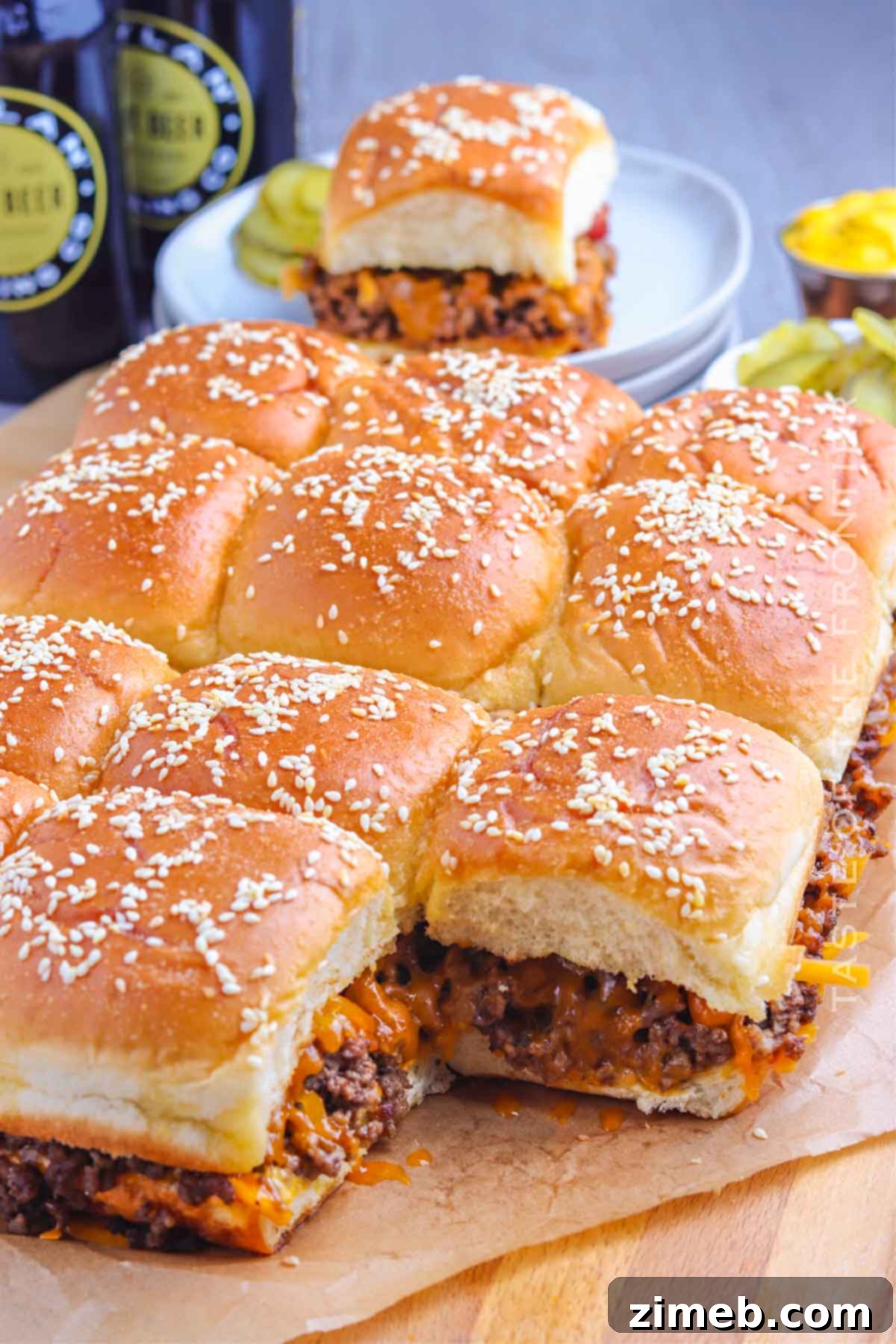 Sweet Hawaiian Cheeseburger Sliders 15 Platter of Cheeseburger Sliders on Hawaiian Rolls, ready to serve.