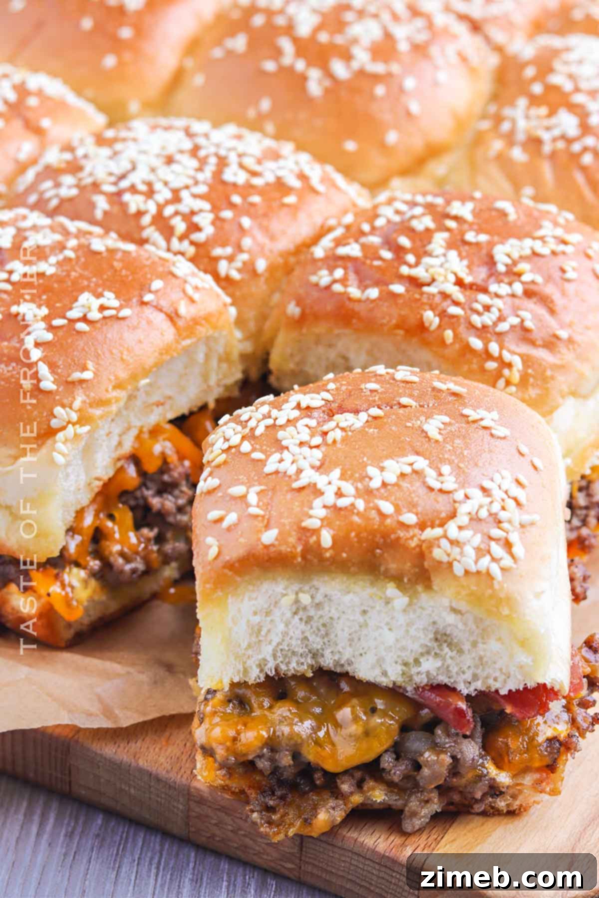 Sweet Hawaiian Cheeseburger Sliders 9 Finished baked Cheeseburger Sliders with golden brown Hawaiian rolls and melted cheese.