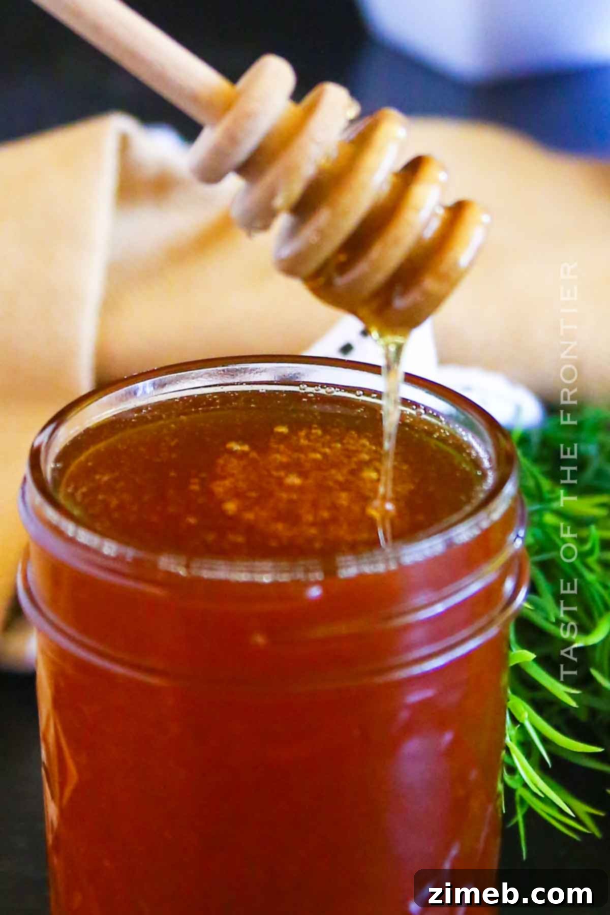 Embered Nectar 16 Smoked Honey in a glass jar, perfectly infused with smoky flavor