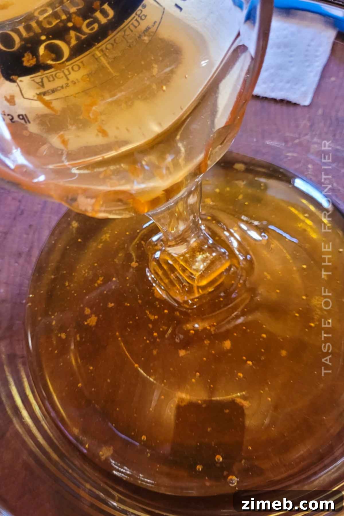 Embered Nectar 5 Traeger Smoked Honey - A Traeger smoker with honey inside, ready to be smoked to perfection
