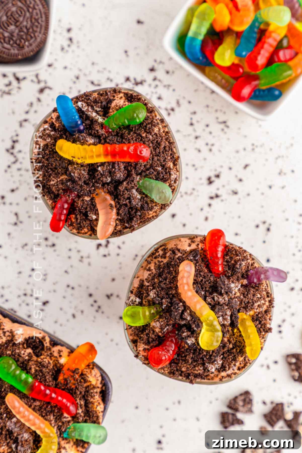 Dreamy Oreo Fluff 8 Oreo Fluff in a clear bowl with more crushed Oreos and gummy worms as a 'dirt' topping.