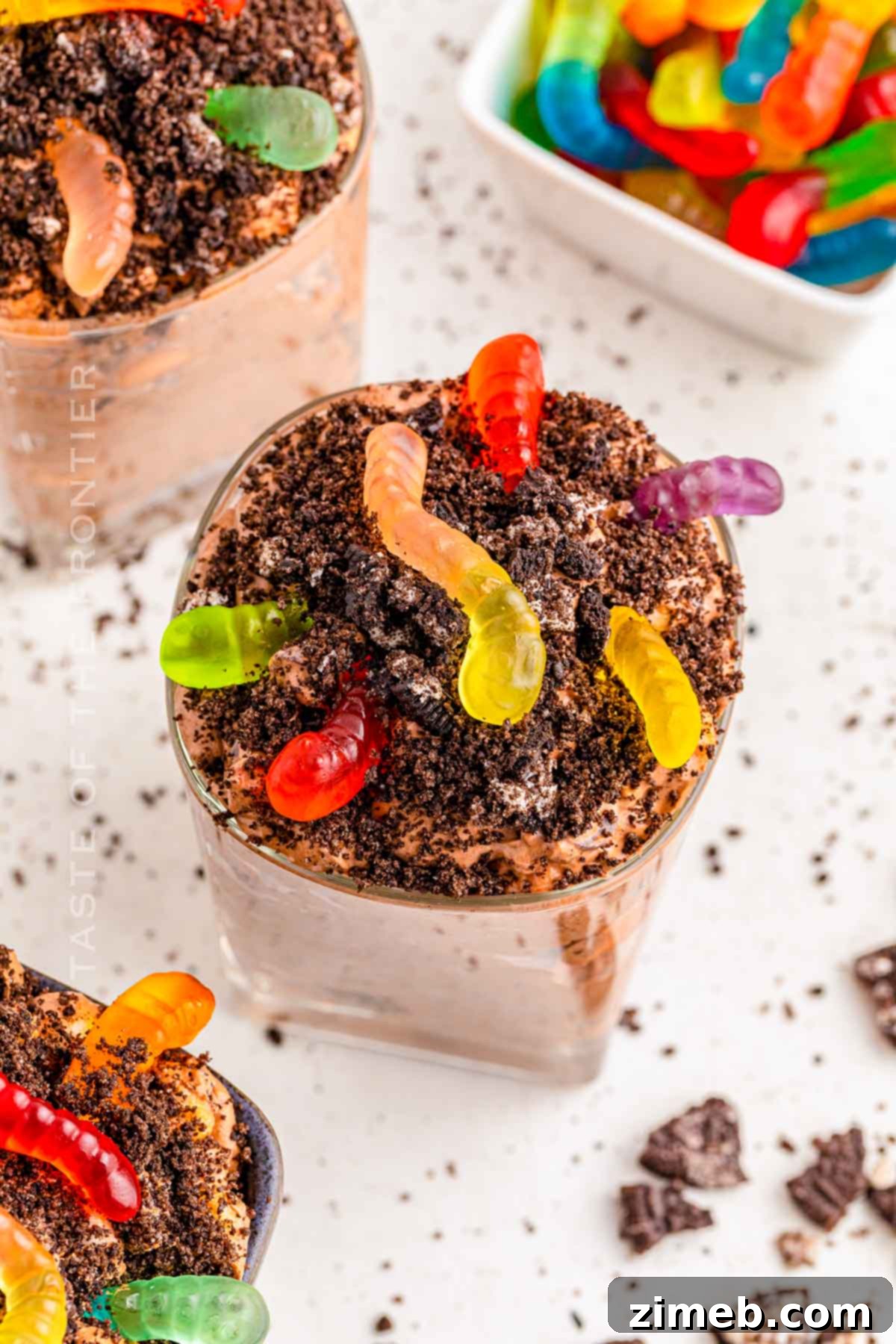 Dreamy Oreo Fluff 9 dirt cups for kids party, made with Oreo Fluff and gummy worms.