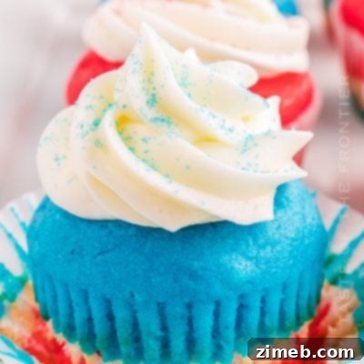 Patriotic Charcuterie Board 12 Fourth of July Cupcakes decorated in red, white, and blue