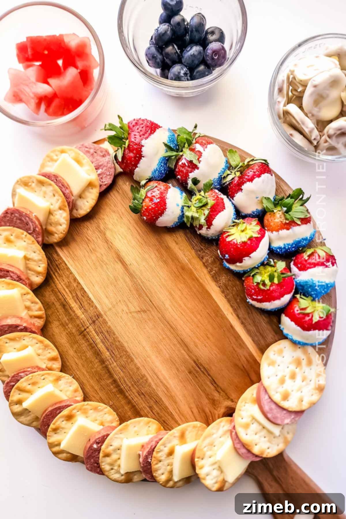 Patriotic Charcuterie Board 7 Adding patriotic berries to the charcuterie board