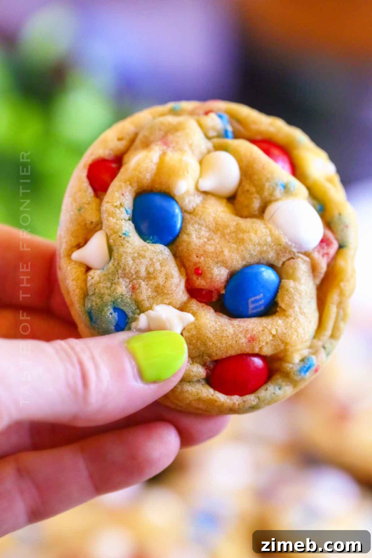 Patriotic Cookie Delights 11 Patriotic M&M and white chocolate chip cookies on a cooling rack
