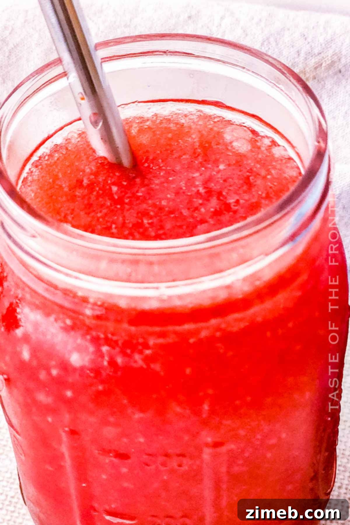 Whip Up Your Own Refreshing Kool-Aid Slushie 16 Icee summer drink in a clear cup, bright blue and refreshing