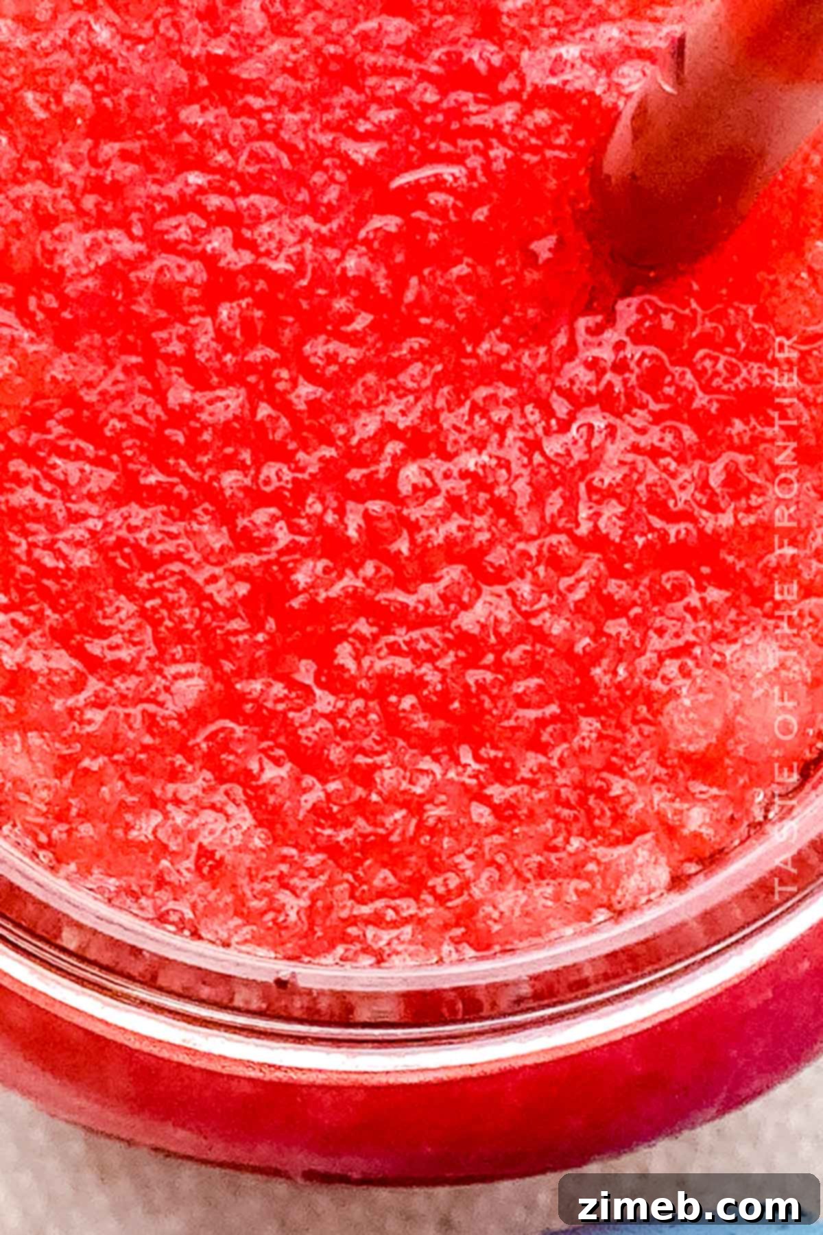Whip Up Your Own Refreshing Kool-Aid Slushie 9 Easy homemade slushie in a clear cup with blue color