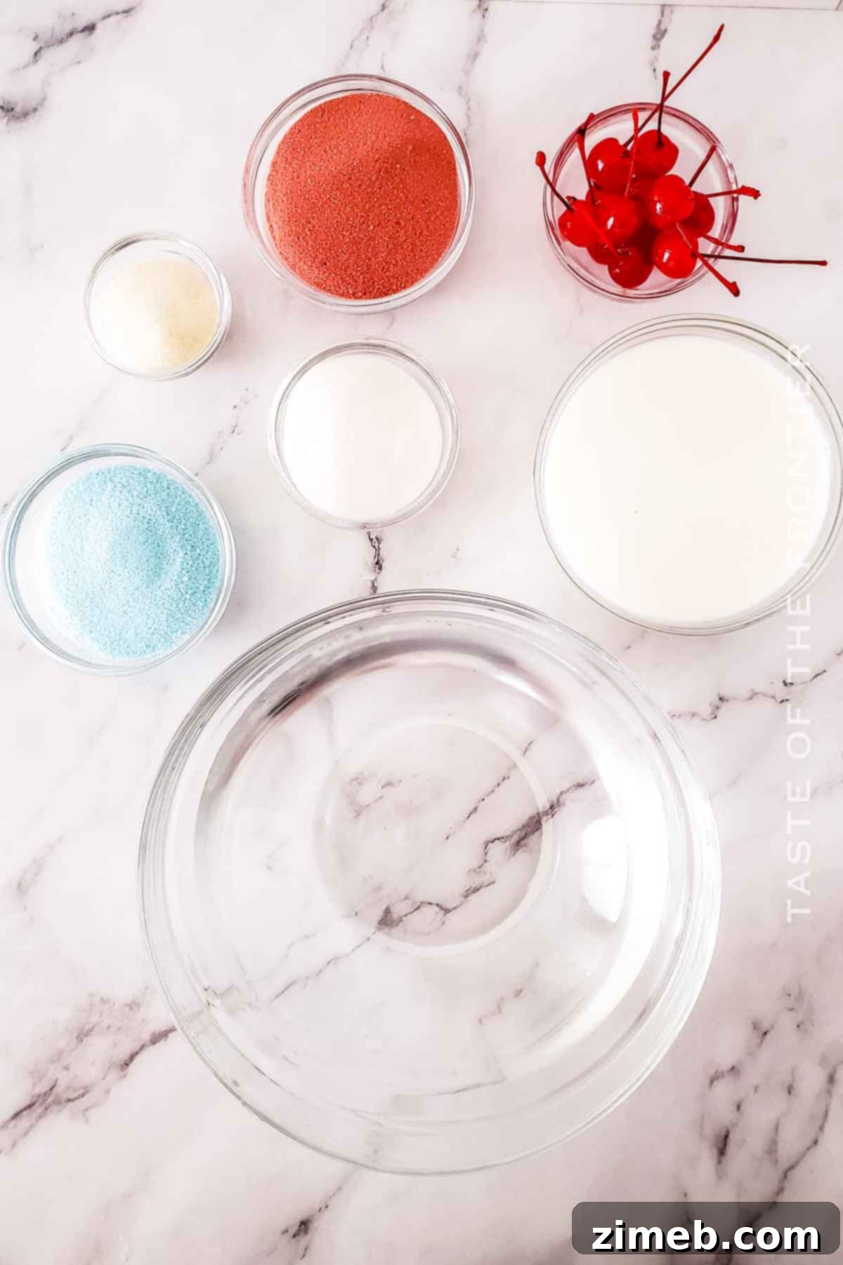 A collection of colorful ingredients for Bomb Pop Jello Shots: blue, red, and unflavored gelatin, milk, sugar, and maraschino cherries.