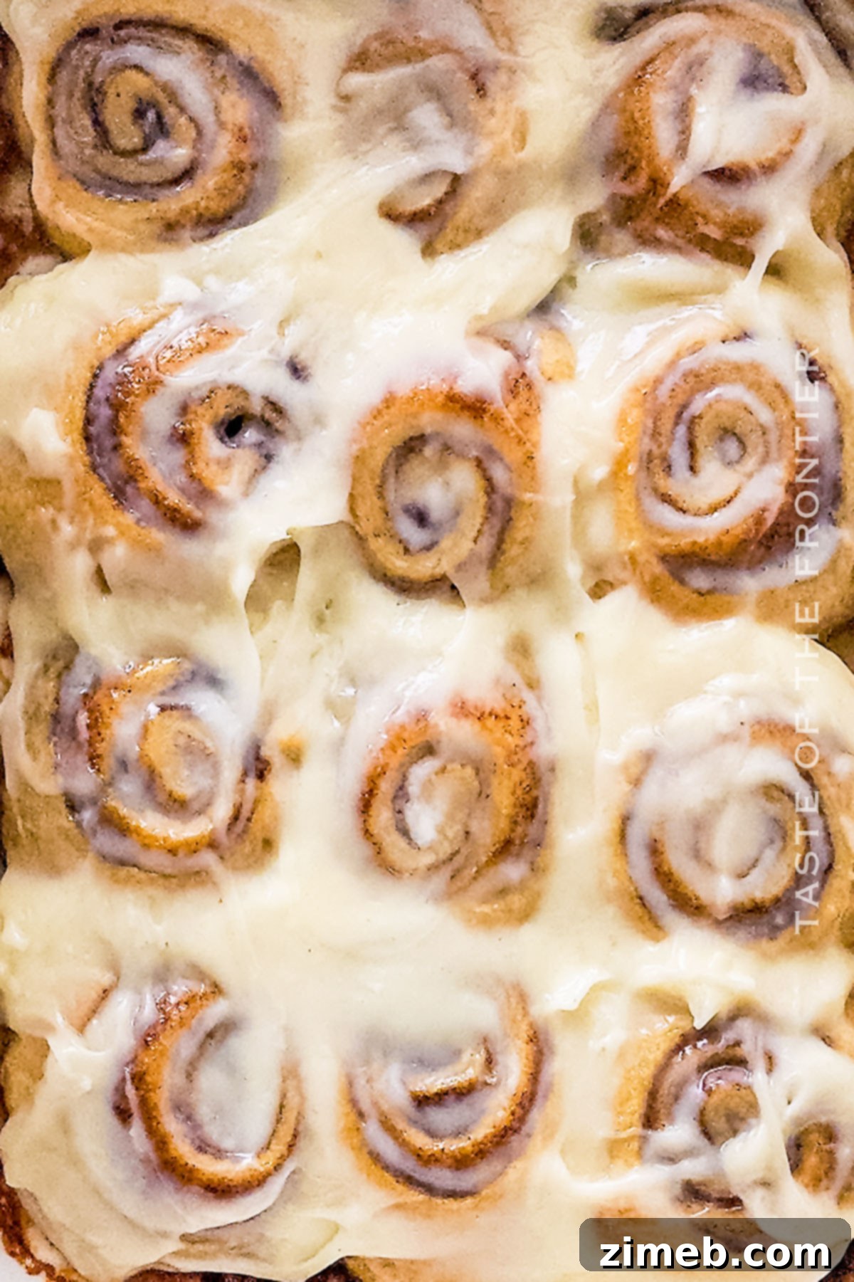 A baking dish filled with fresh, warm Crescent Roll Cinnamon Roll Recipe, ready for serving.