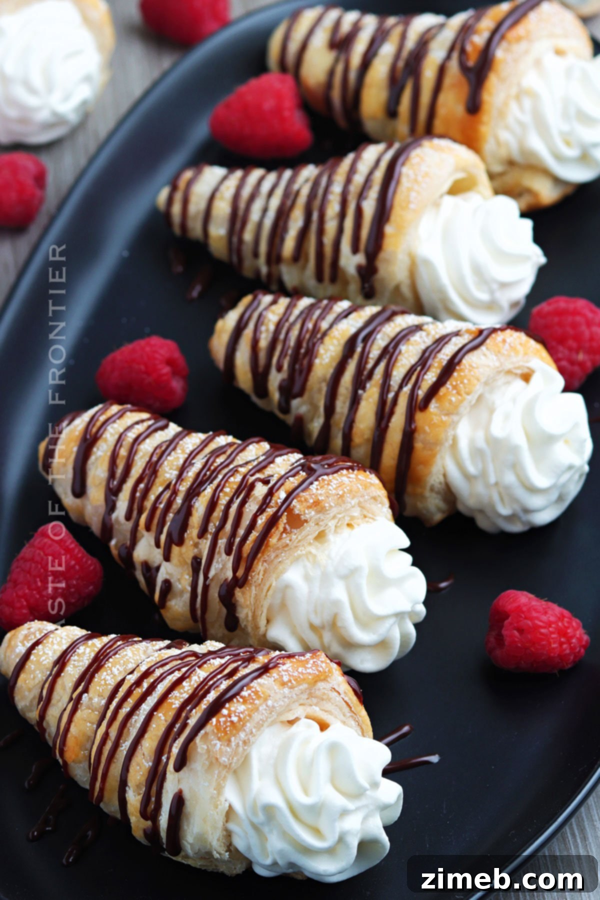 Whipped cream filled pastries with chocolate drizzle