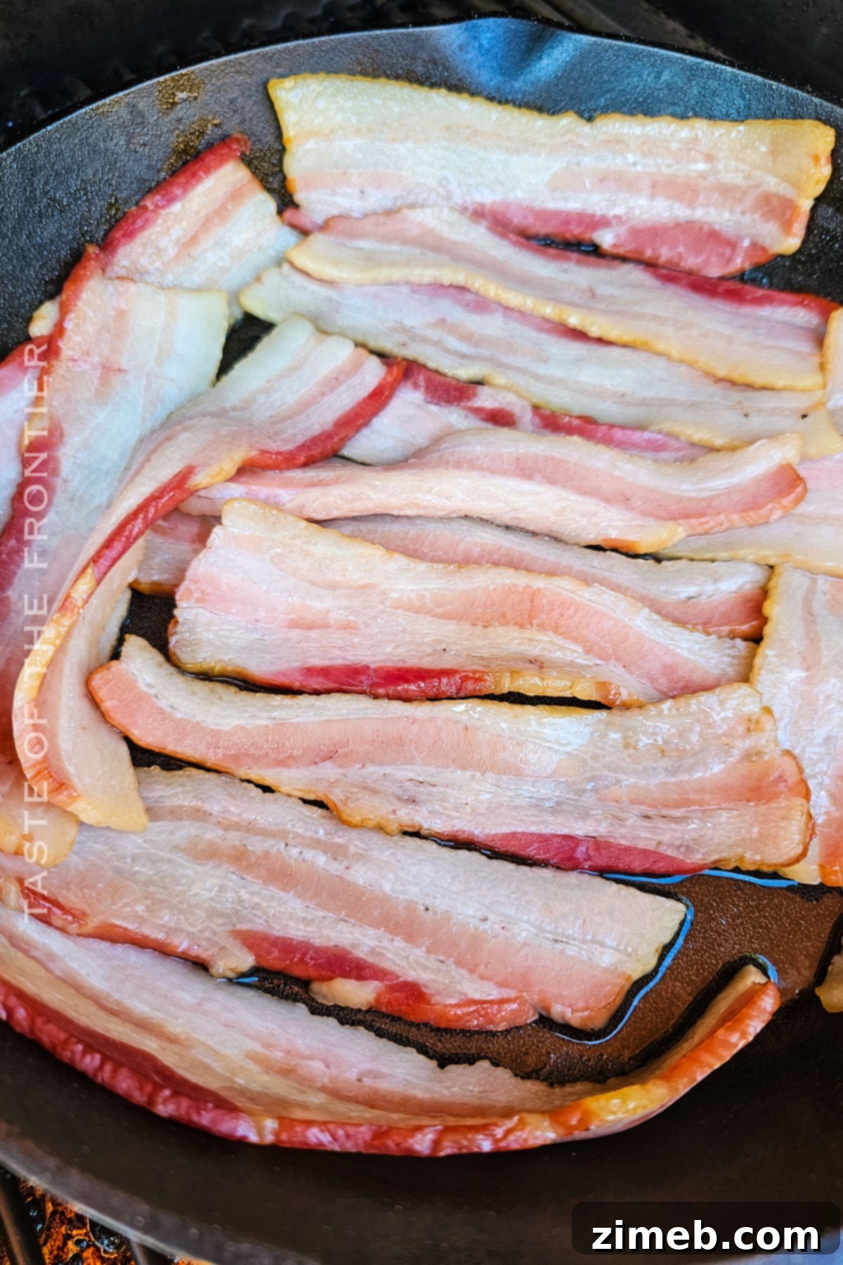 Gourmet Smoked Bacon 6 Step-by-step image of bacon slices arranged in a cast iron skillet before smoking.