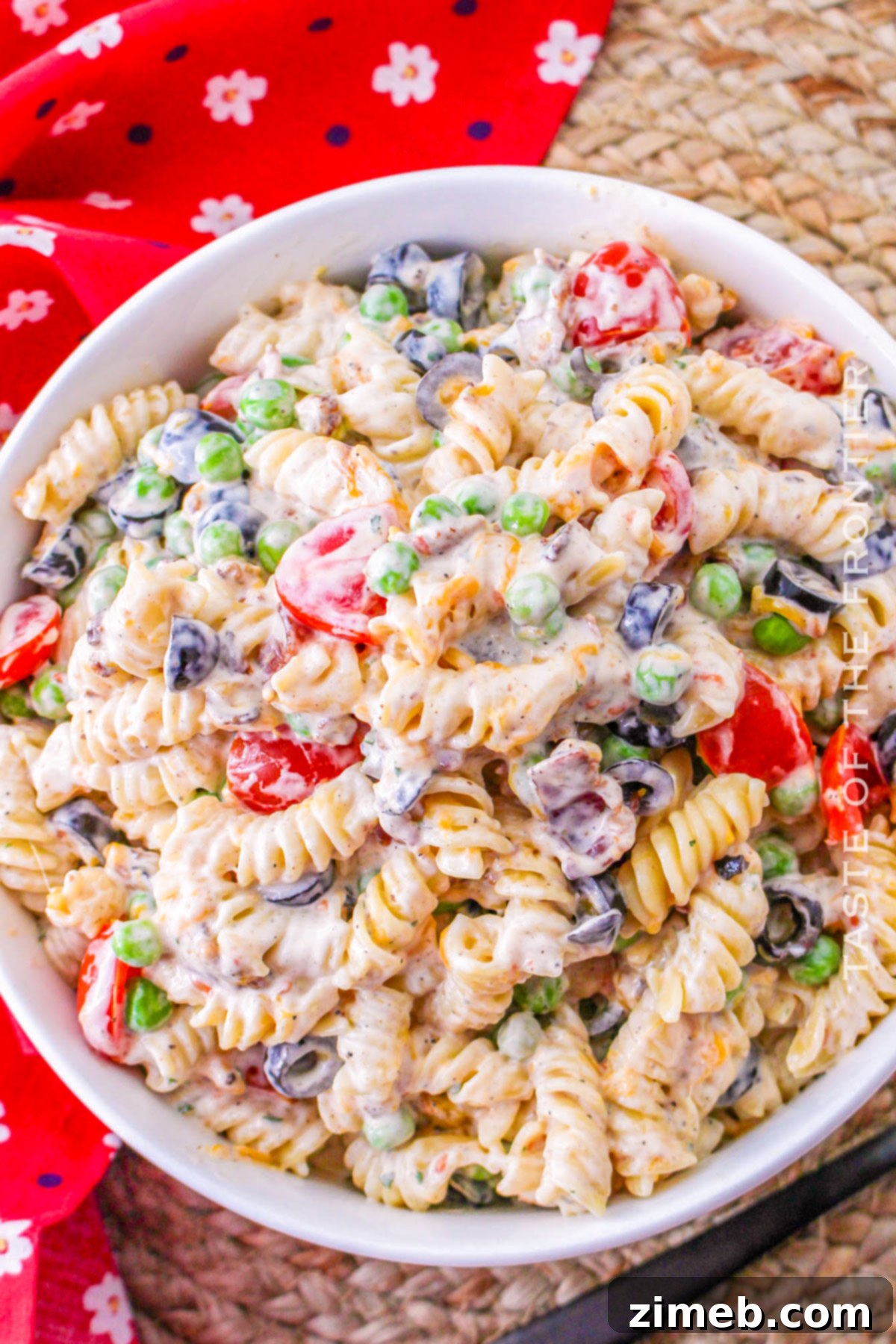 A vibrant cold pasta salad, perfect as a potluck side dish, filled with fresh ingredients and creamy dressing.