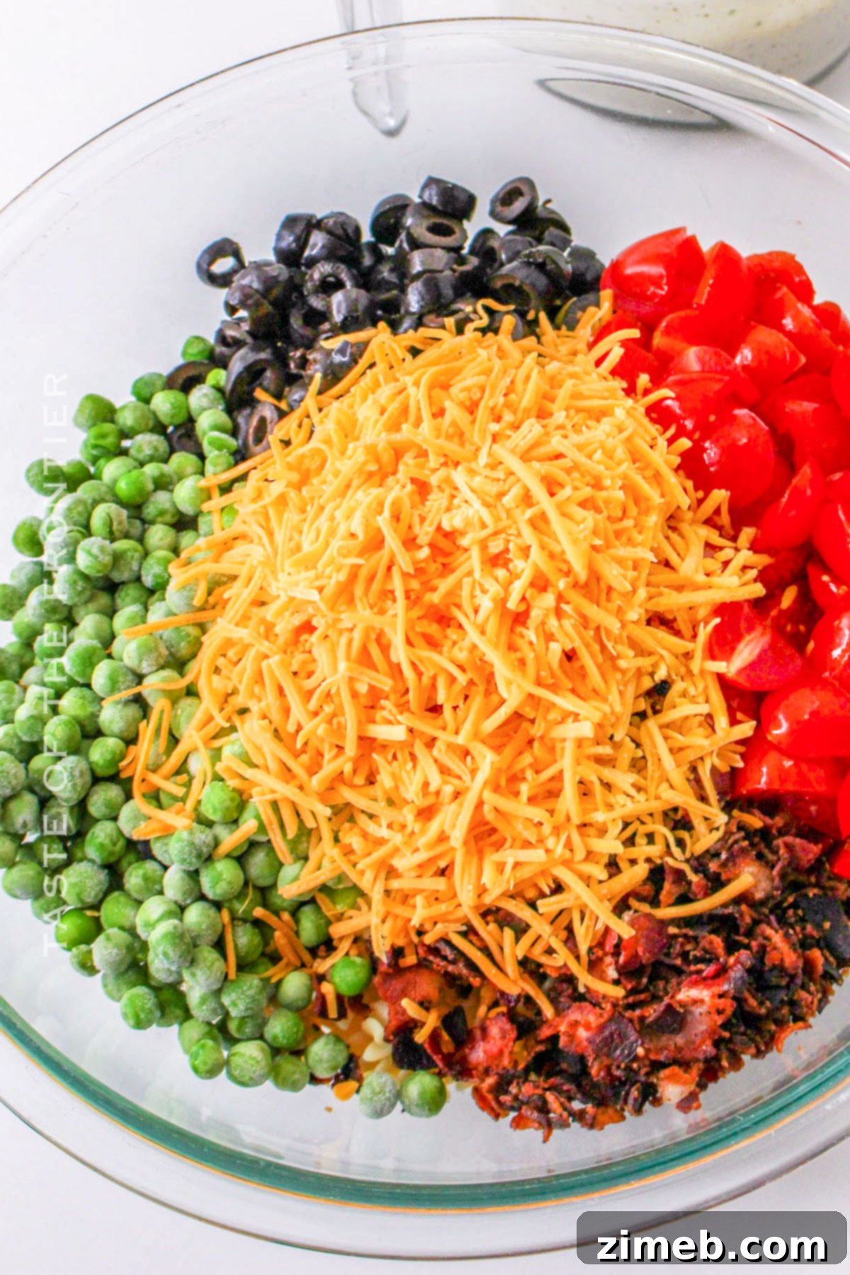 All ingredients for Bacon Ranch Pasta Salad combined in a large bowl, ready for the dressing.