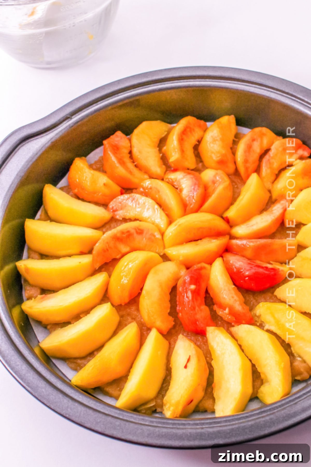 adding the peaches to the brown sugar crumble in a pan