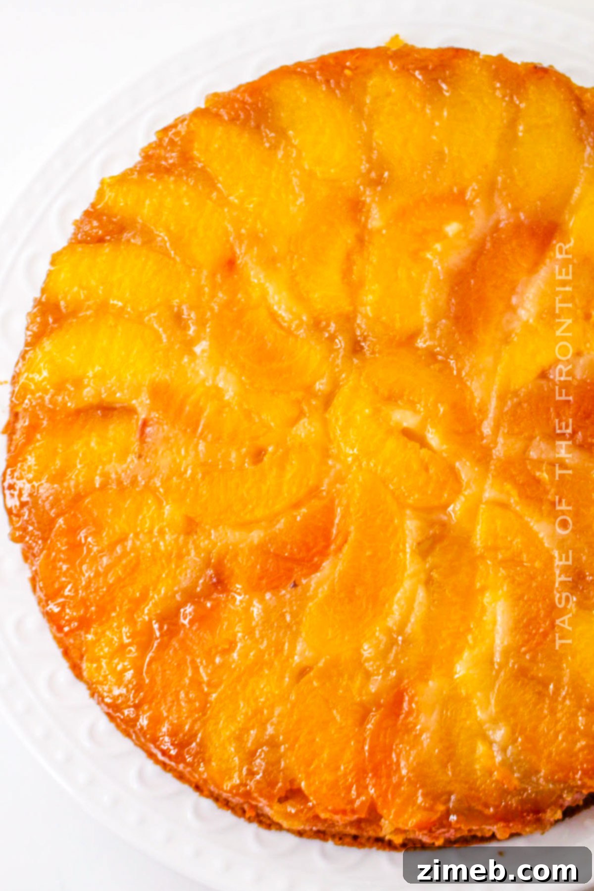 upside down peach cake on a serving dish