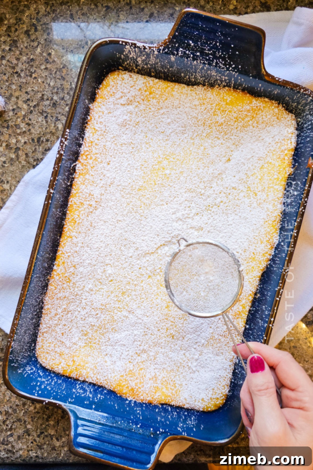 Dusting Lemon Bars with Confectioner's Sugar
