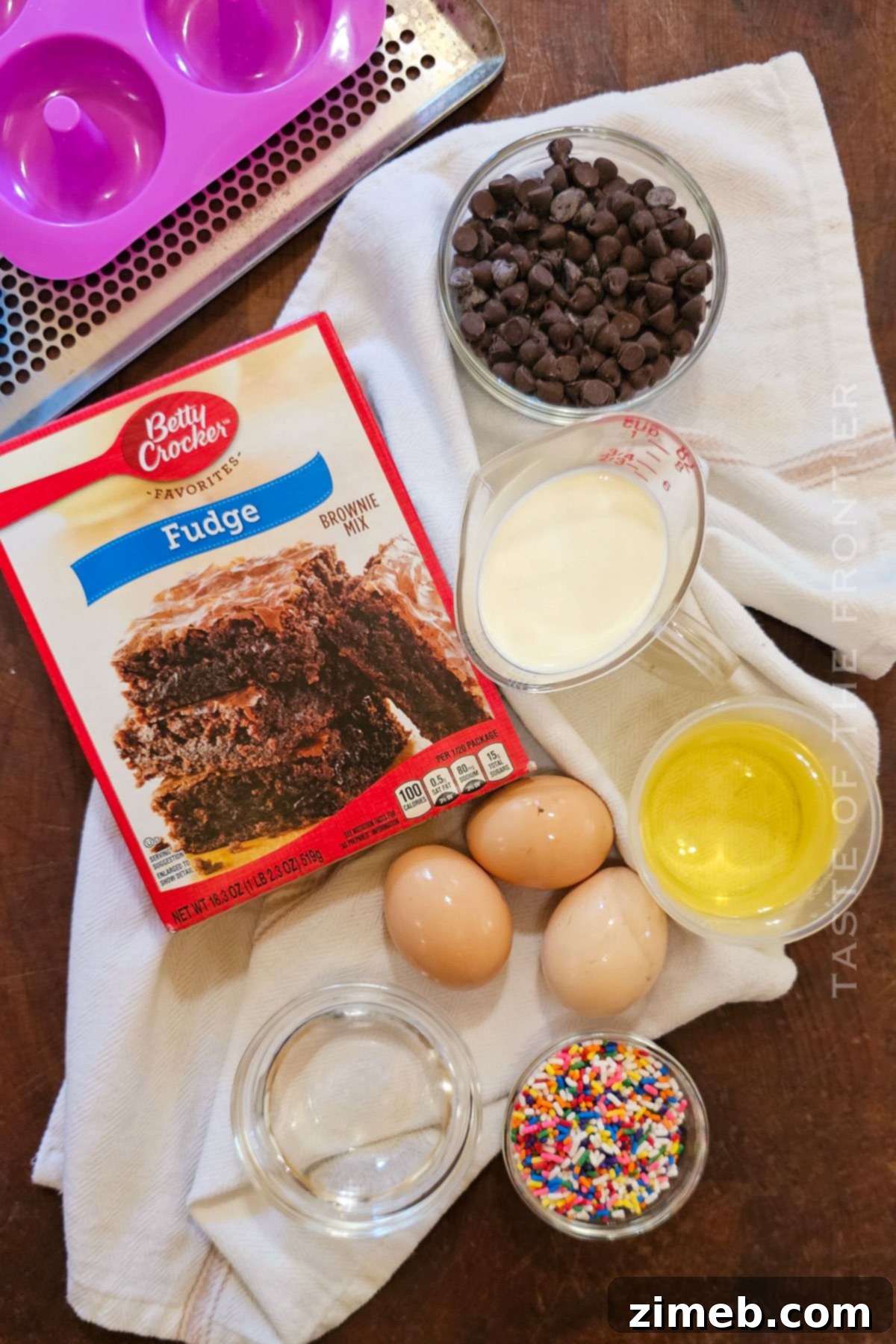 Bronuts 4 Bronut ingredients with brownie mix, eggs, oil, water, chocolate chips, heavy cream, vanilla extract