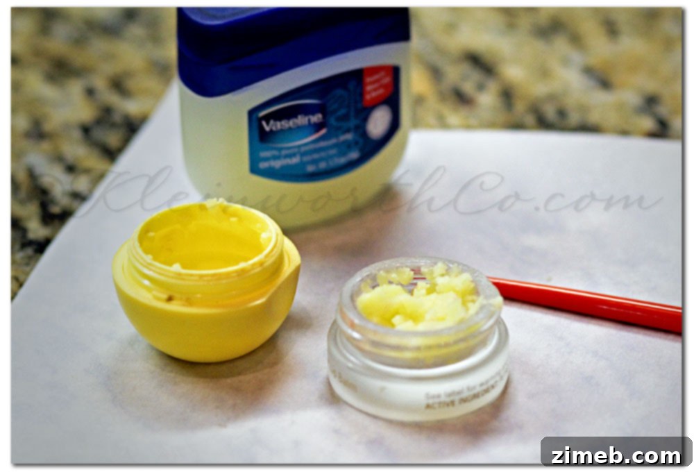 Scraping leftover lip balm from a tube into a pot
