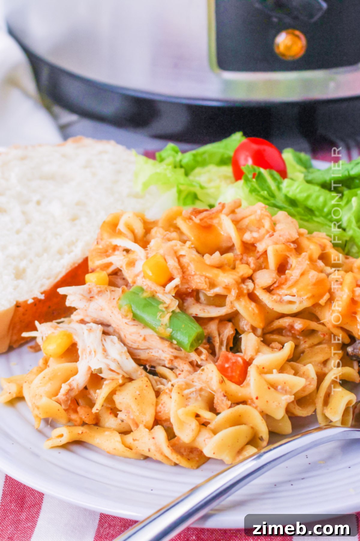 Creamy Slow Cooker Chicken Pasta 15 Close-up of chicken pasta dinner in a bowl, ready to serve