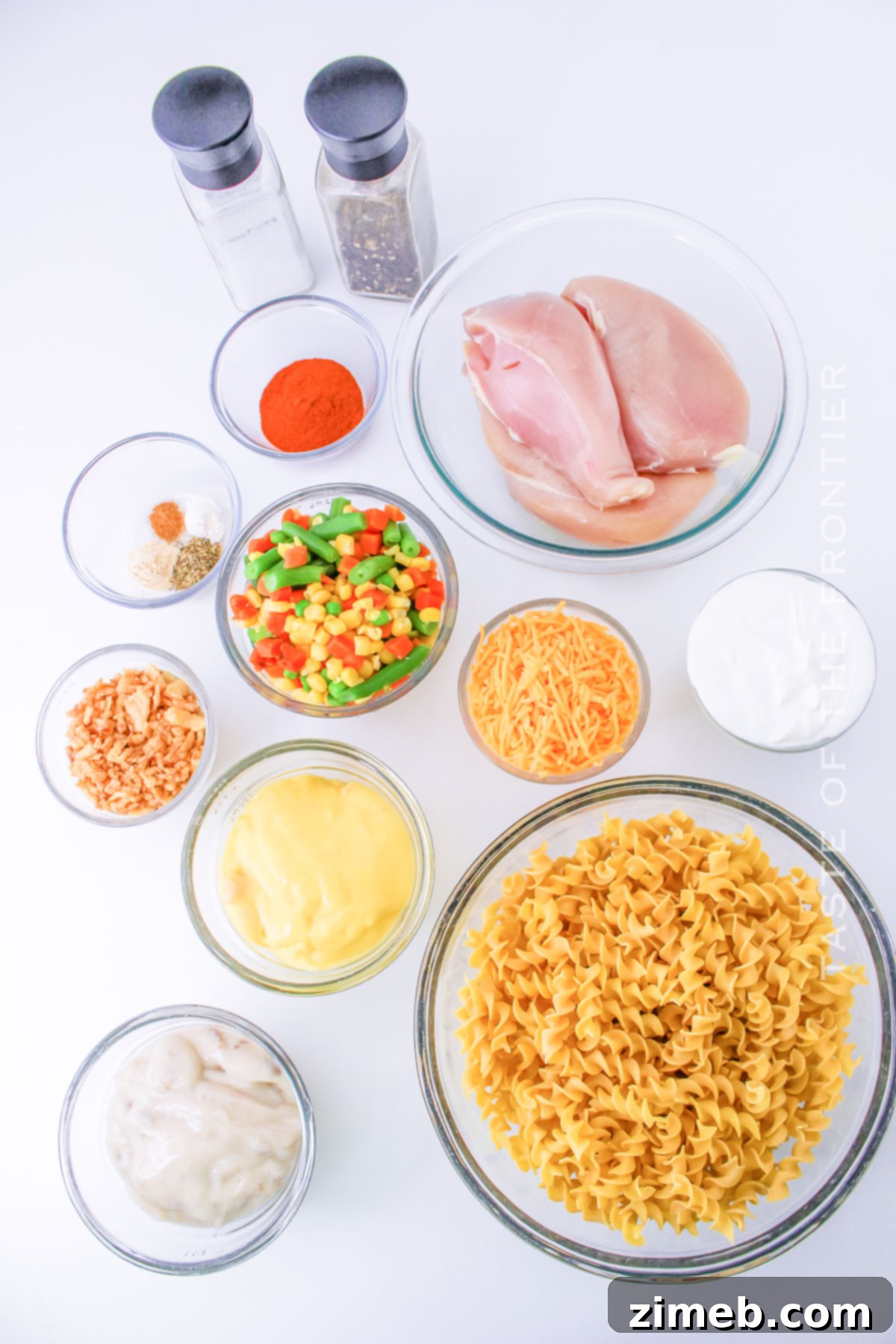 Creamy Slow Cooker Chicken Pasta 4 Ingredients laid out for Slow Cooker Chicken Pasta, AKA Crockpot Chicken Noodle Casserole