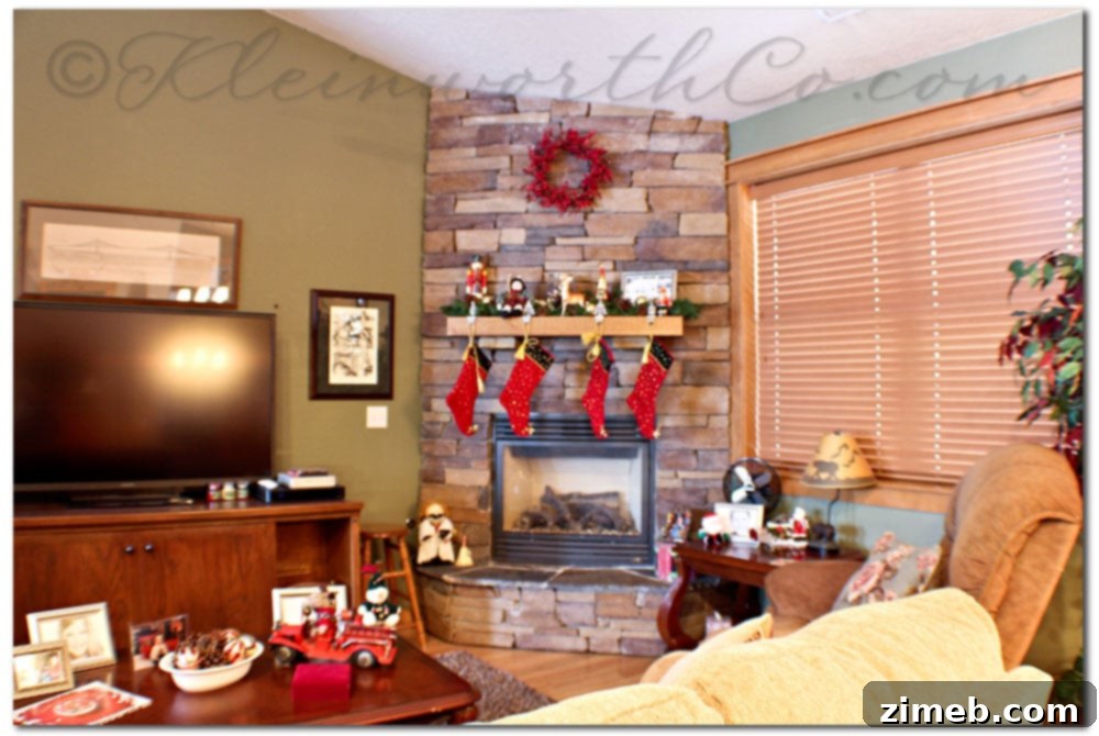 Cabin family room fireplace before rustic winter mantle decor