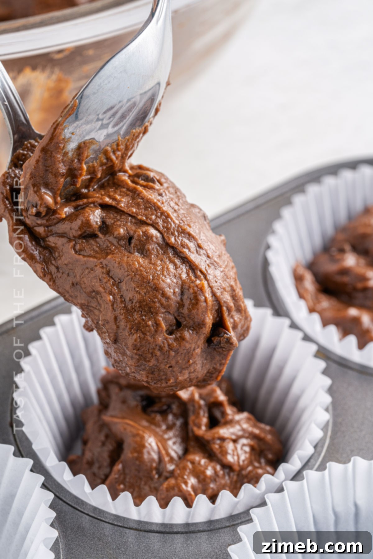 Thick double chocolate muffin batter ready for baking.