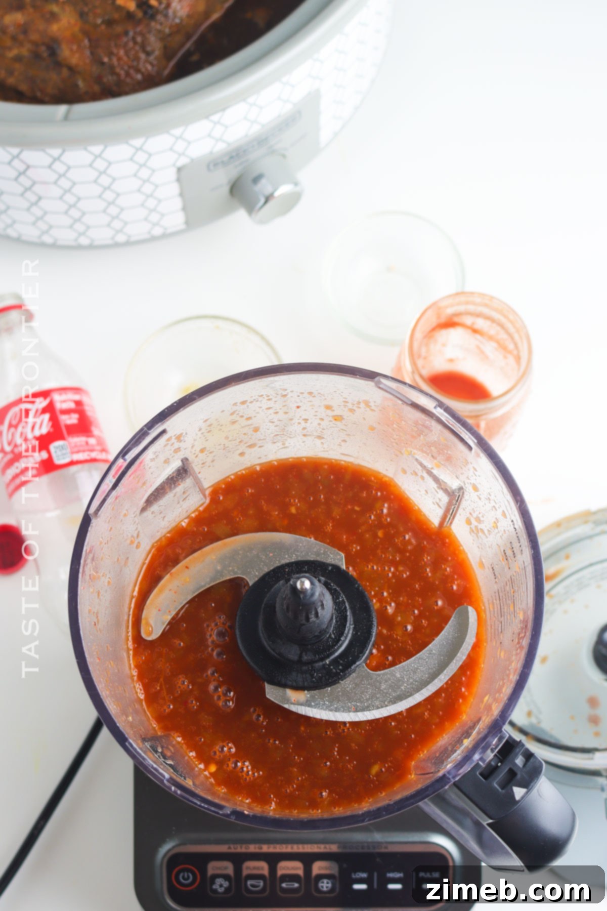Irresistible Cafe Rio Sweet Pork 5 Red sauce and pork cooking in slow cooker