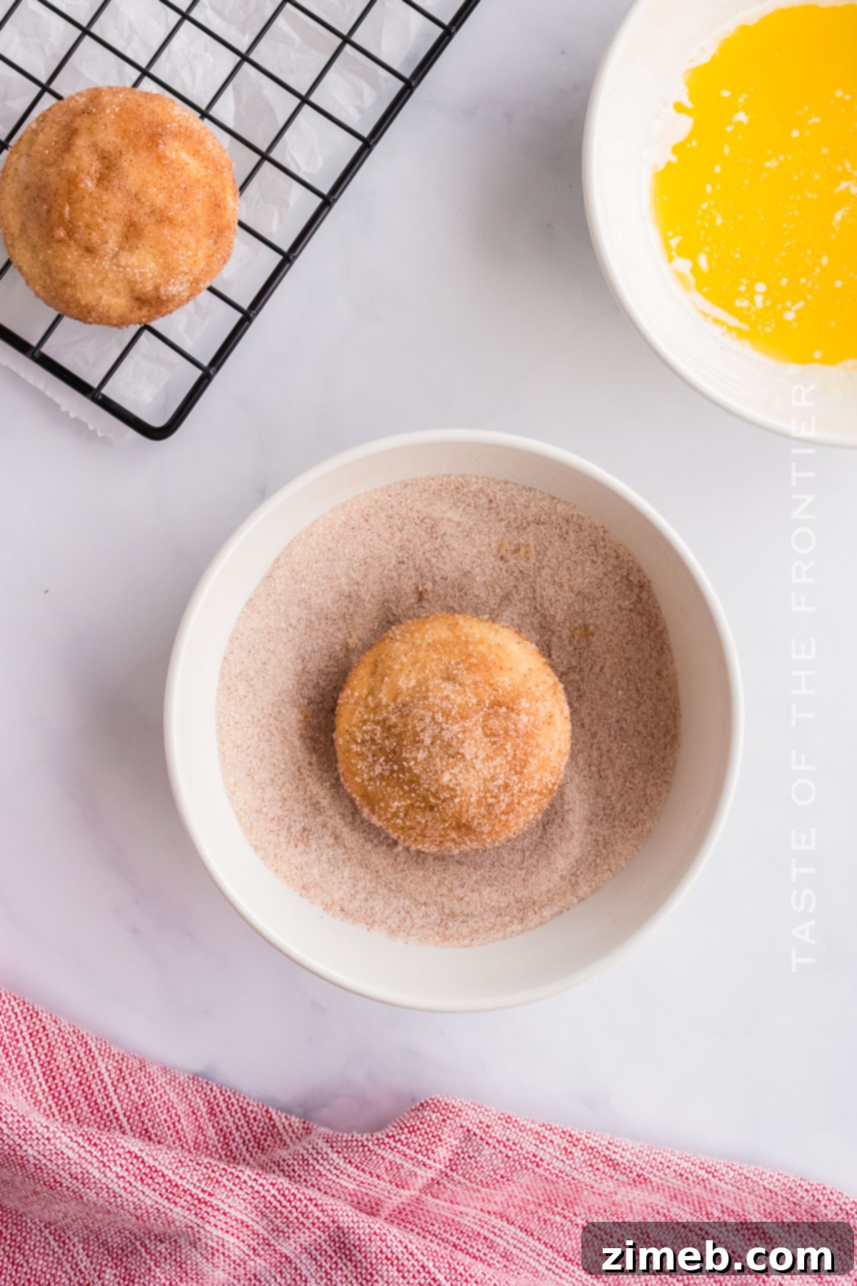Sweet Cinnamon Cloud Muffins 8 Adding the cinnamon sugar coating to warm muffins