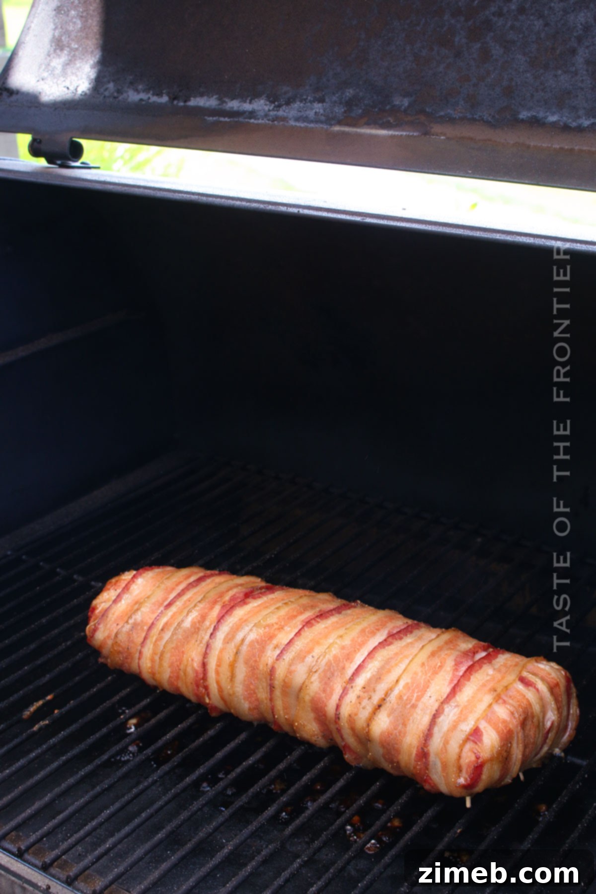 Tender Smoked Pork Loin 7 Smoked pork tenderloin on a pellet grill, ready to serve