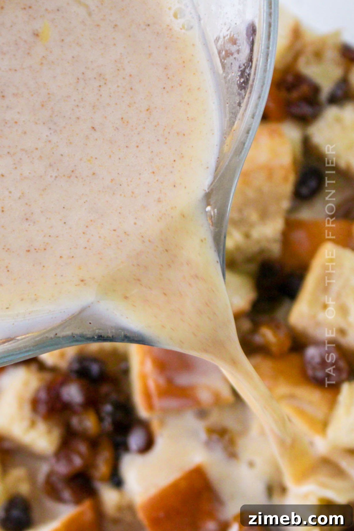 Warm Bread Pudding Drizzled with Vanilla Cream 6 adding the egg mixture