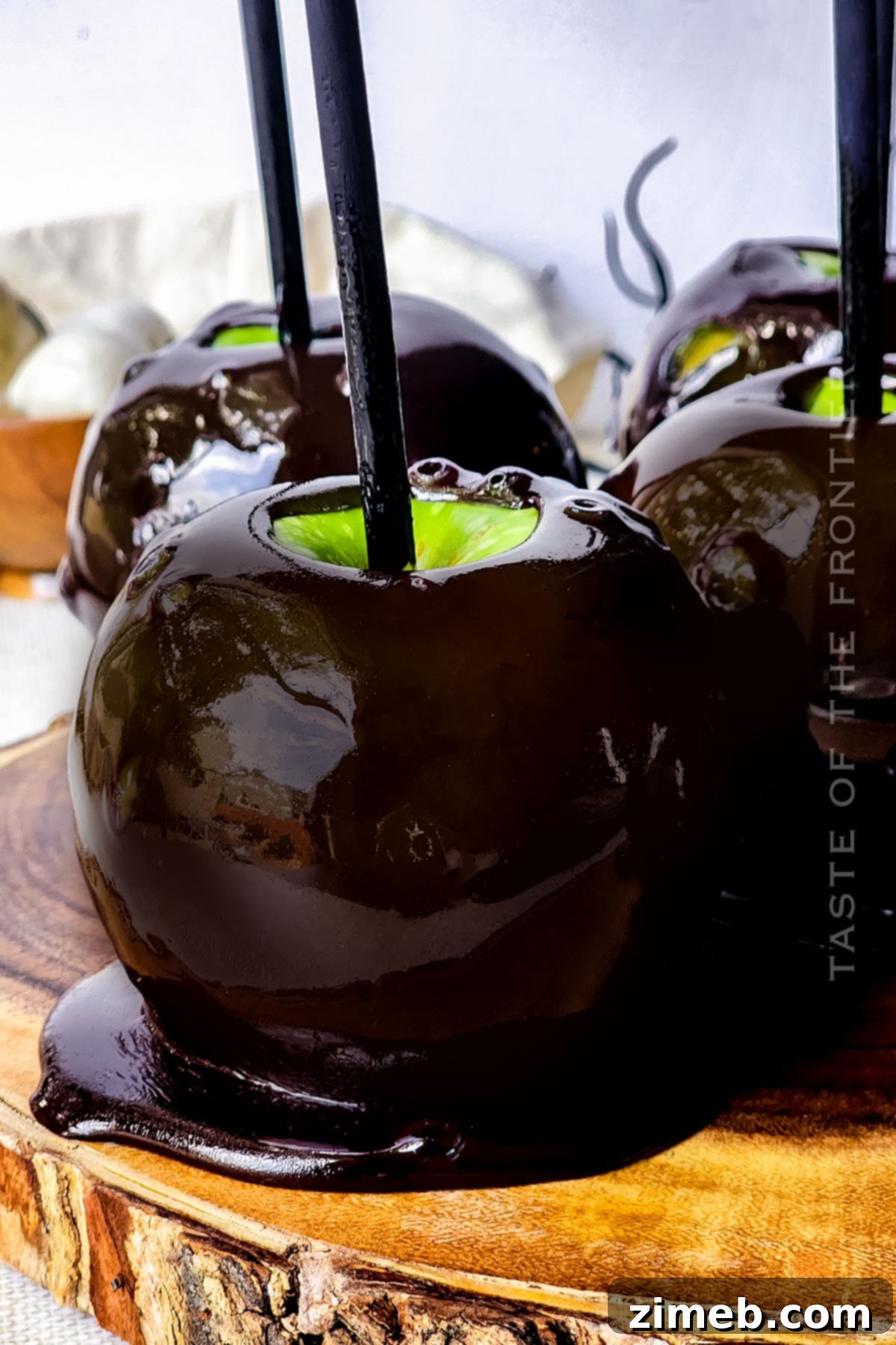 Midnight Candy Apples 14 A black candy apple showcasing its perfectly set, glossy coating, ready for Halloween.