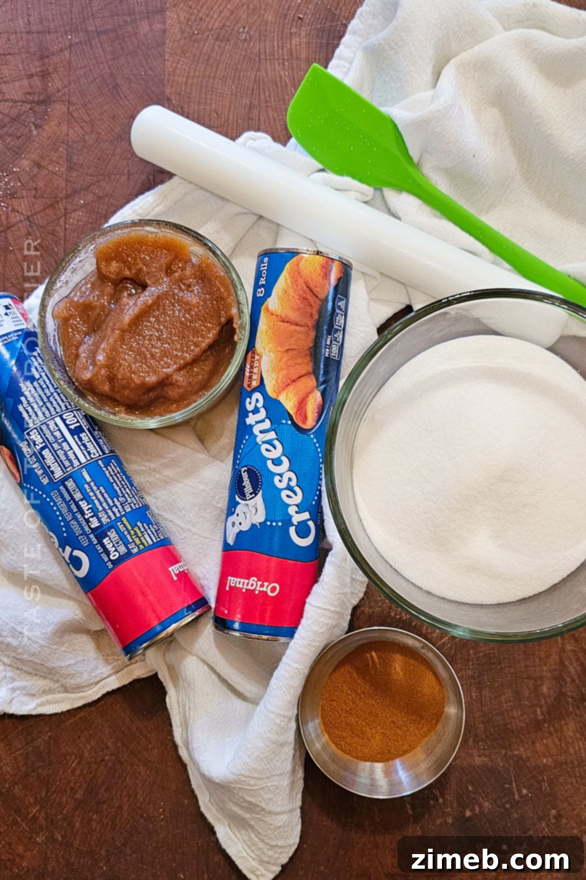 Ingredients for making Apple Butter Cruffins, including crescent roll dough and apple butter