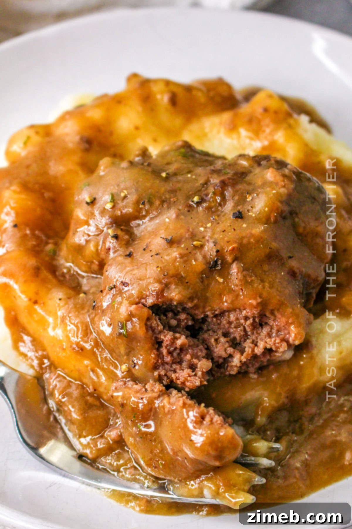 Tender Slow Cooker Cube Steak 2 Crock Pot Cubed Steak - A hearty and flavorful slow cooker recipe for tender beef patties in creamy gravy, perfect for easy weeknight dinners.