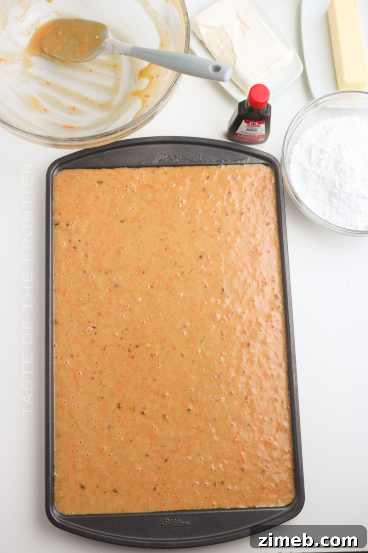 Ready to bake Carrot Cake Bars - Batter in a pan.