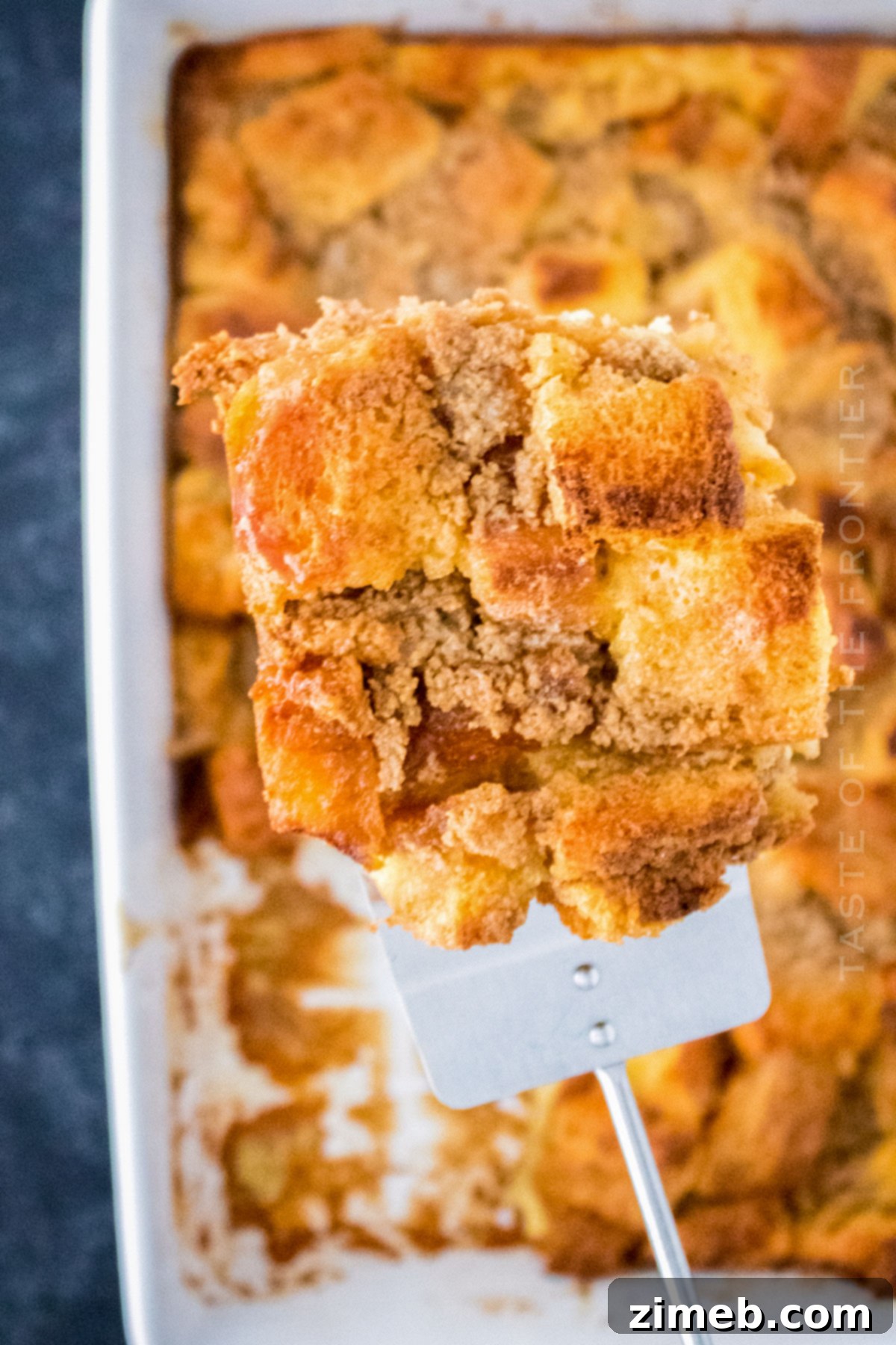 Decadent Caramel French Toast 3 Close-up of baked caramel breakfast treat in a casserole dish.
