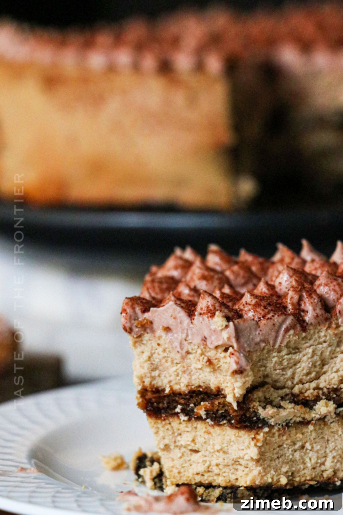 A delicious bite of cheesecake on a fork.