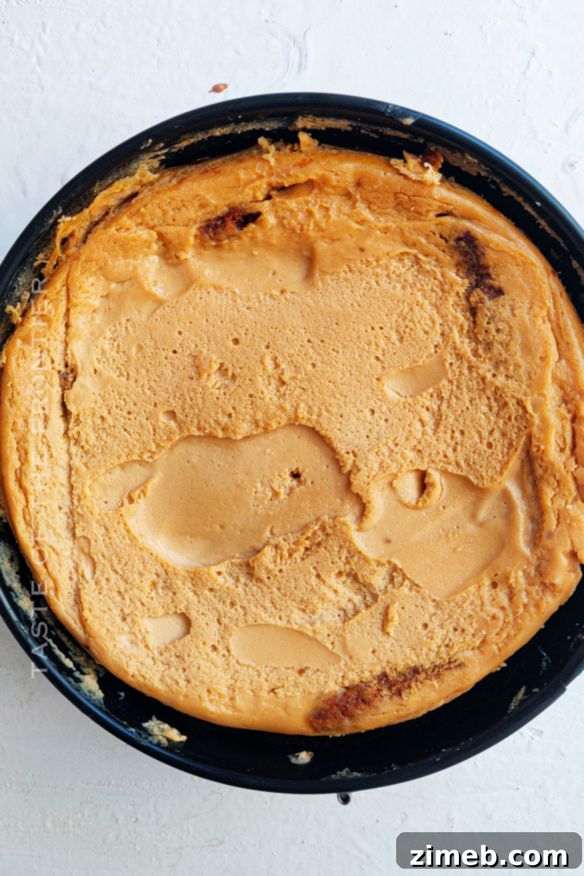Baked cheesecake cooling, ready for the next steps.