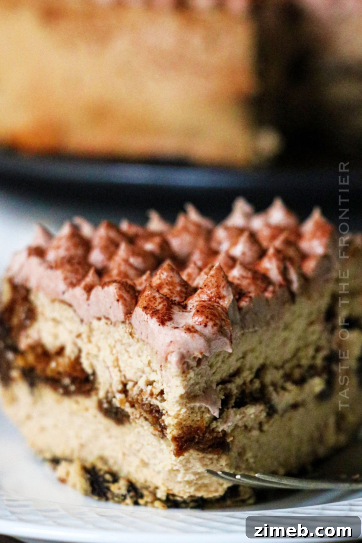 Slice of Espresso Cheesecake showing its intricate layers.