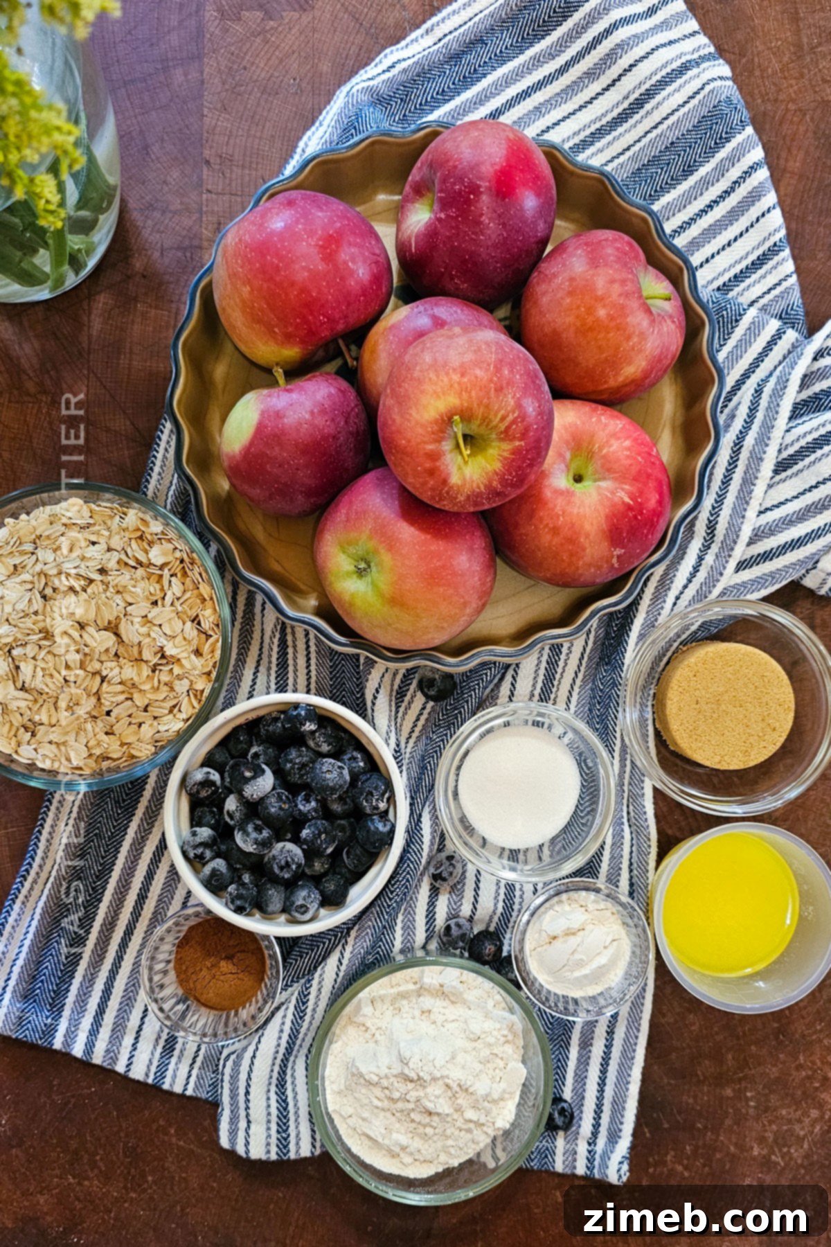 Apple and Blueberry Crumble ingredients – showcasing fresh, vibrant apples and blueberries alongside baking essentials.