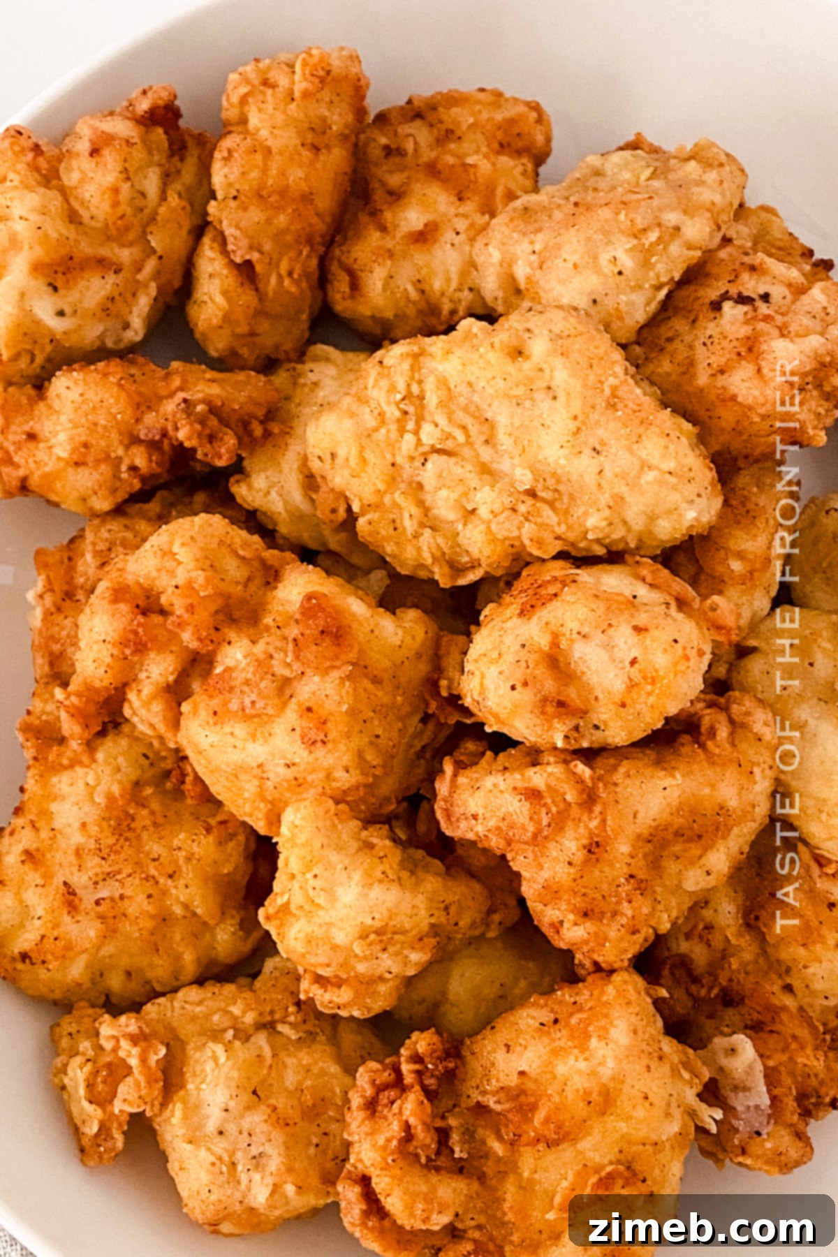 Perfectly Crispy Homemade Chicken Nuggets 8 Final plated image of delicious copycat Chick-fil-A chicken nuggets with a fresh garnish
