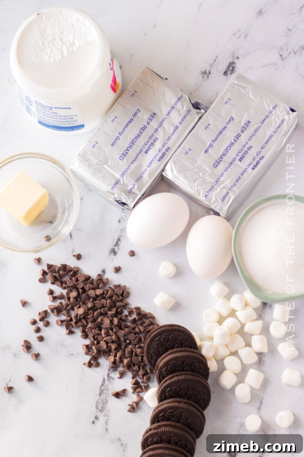 ingredients for hot chocolate cheesecake, including chocolate chips and cream cheese