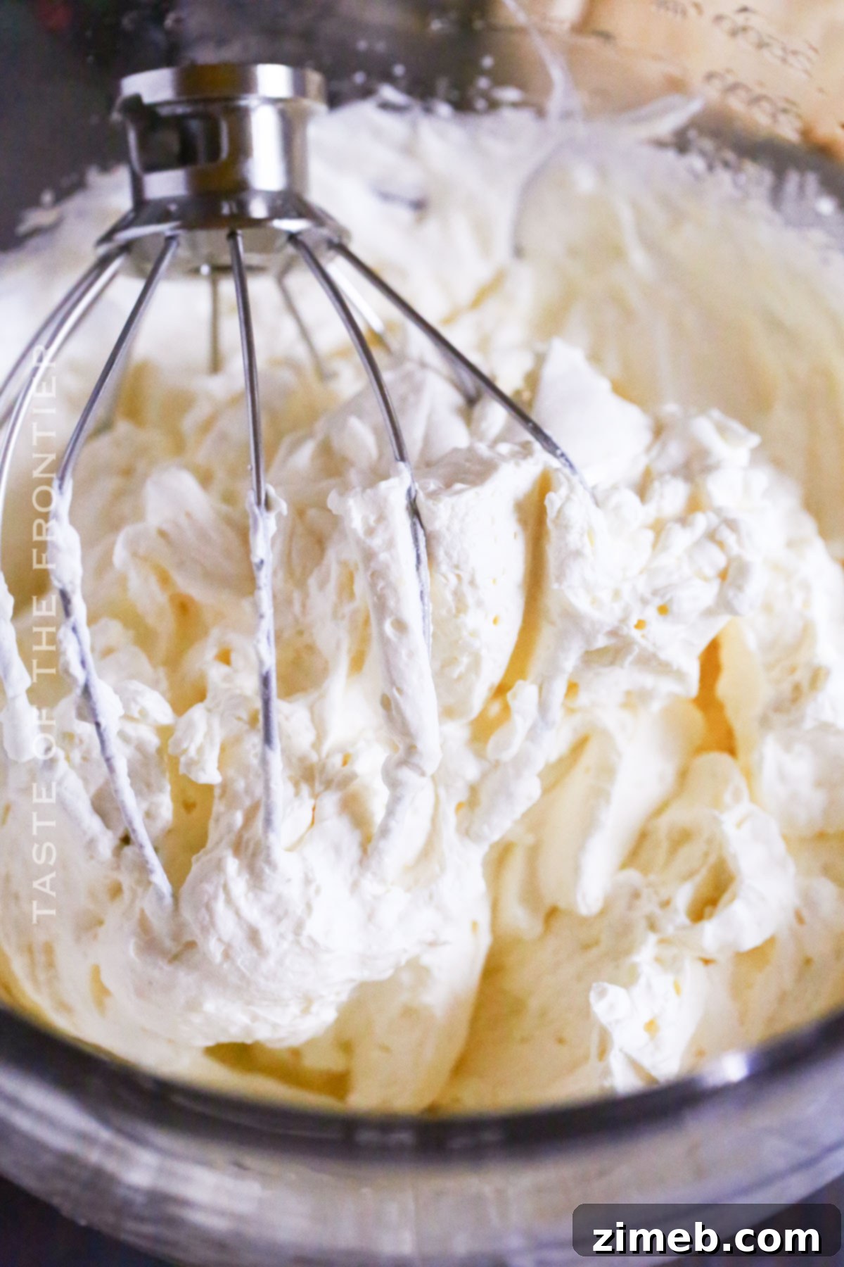 Cloud-Light Frosting 6 Stabilized Sweet Cream Frosting being piped onto a dessert