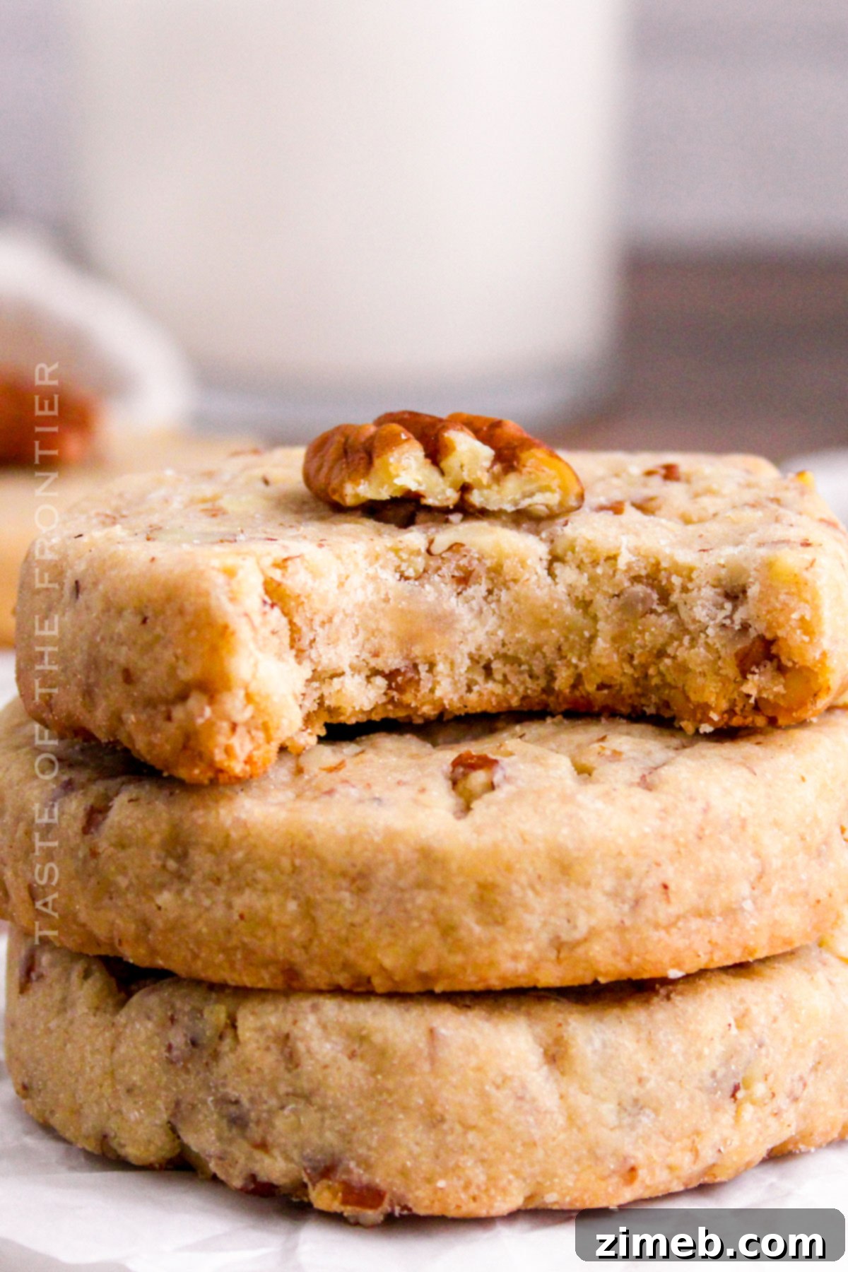 Melt-in-Your-Mouth Pecan Sandies Cookie Recipe 2 stack of buttery pecan sandies cookies
