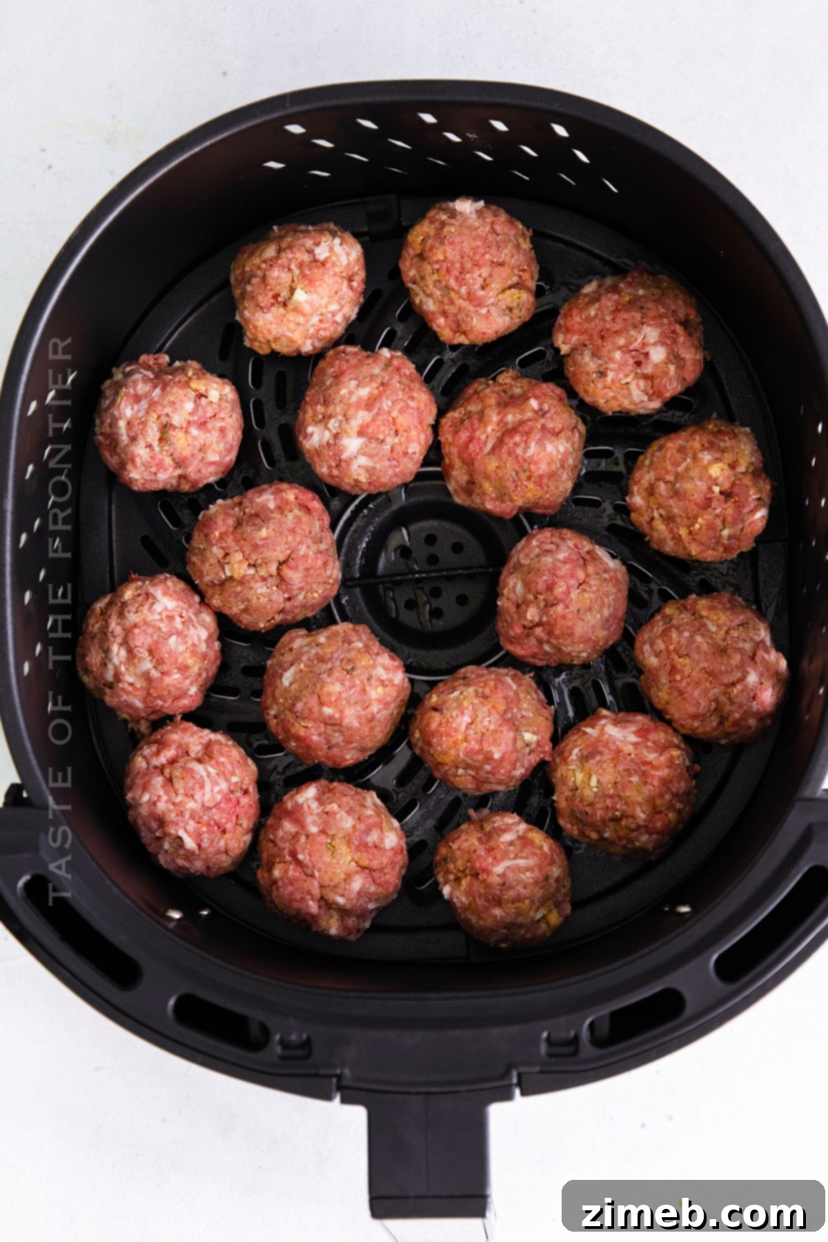 Golden Air Fryer Garlic Parmesan Meatballs 7 cooking meatballs in the air fryer
