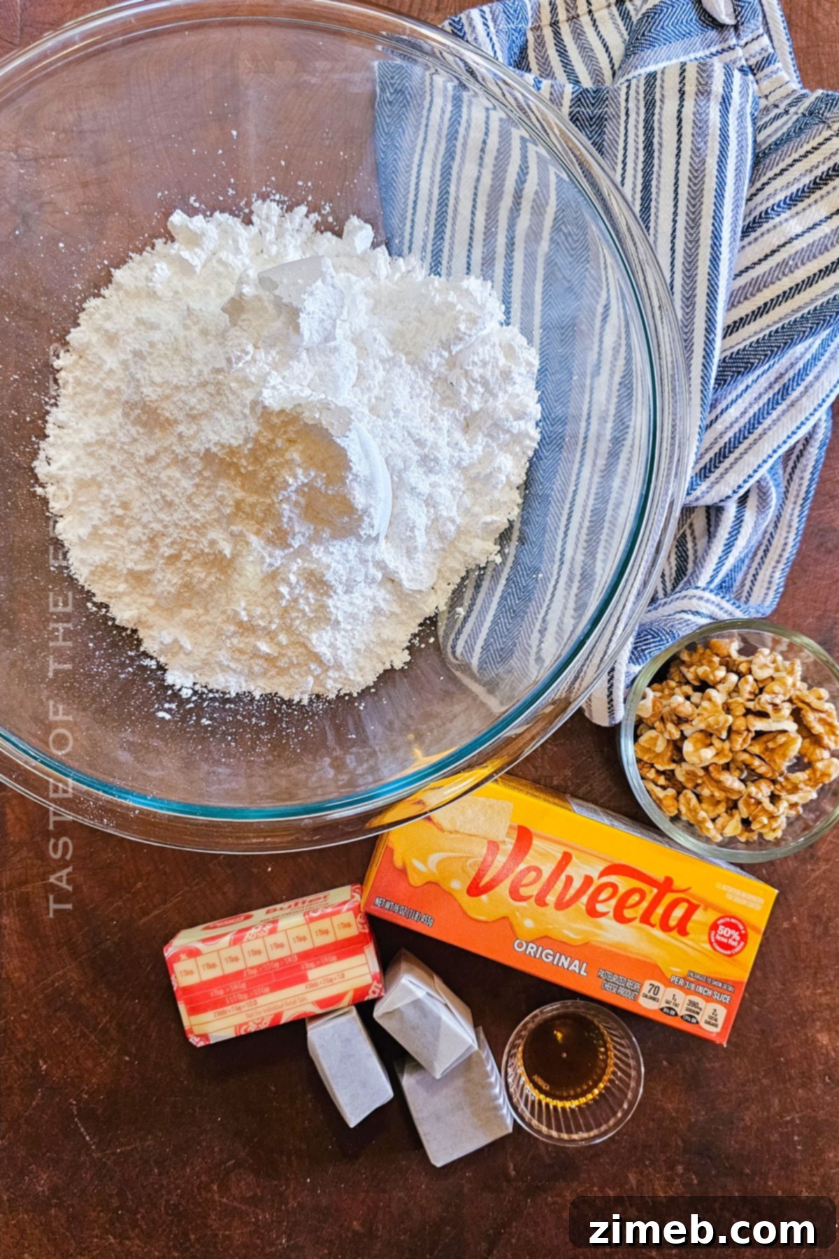Surprisingly Delicious Velveeta Fudge 4 A close-up of the simple, high-quality ingredients for Velveeta Fudge, including Velveeta cheese, butter, and chocolate.