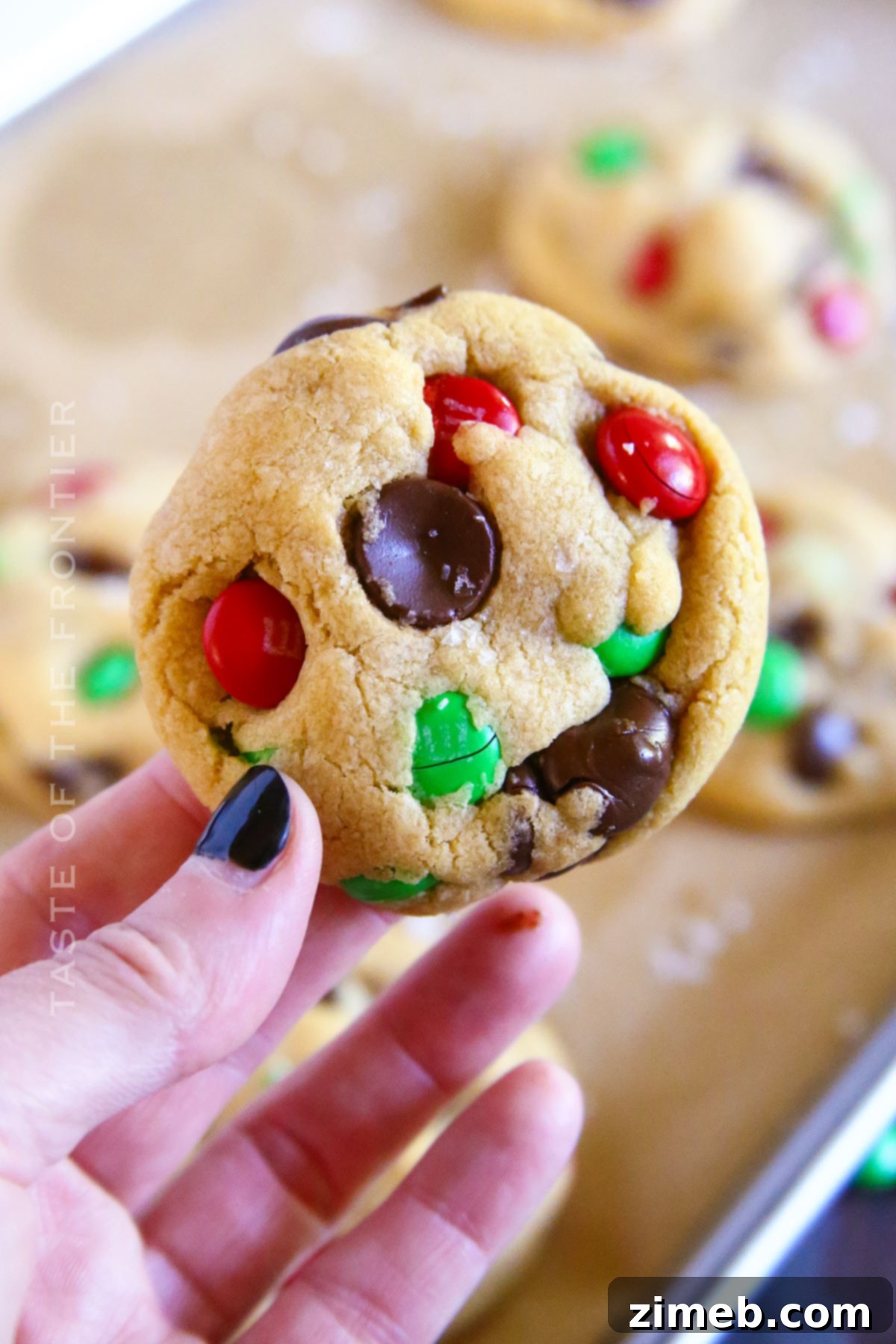 A small batch of holiday chocolate chip cookies on a festive tray