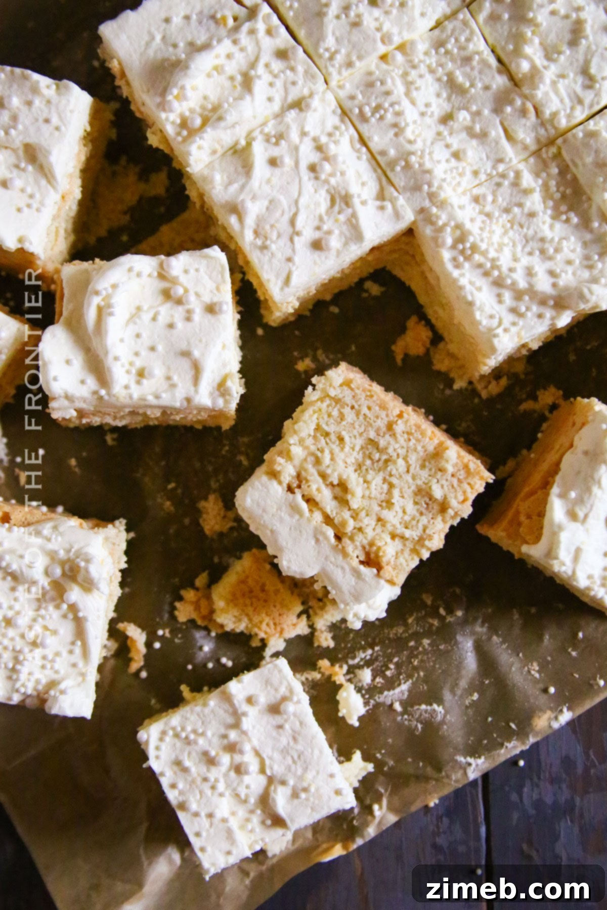 Close-up of a slice of White Chocolate Mud Cake, showcasing its dense texture and rich flavor.