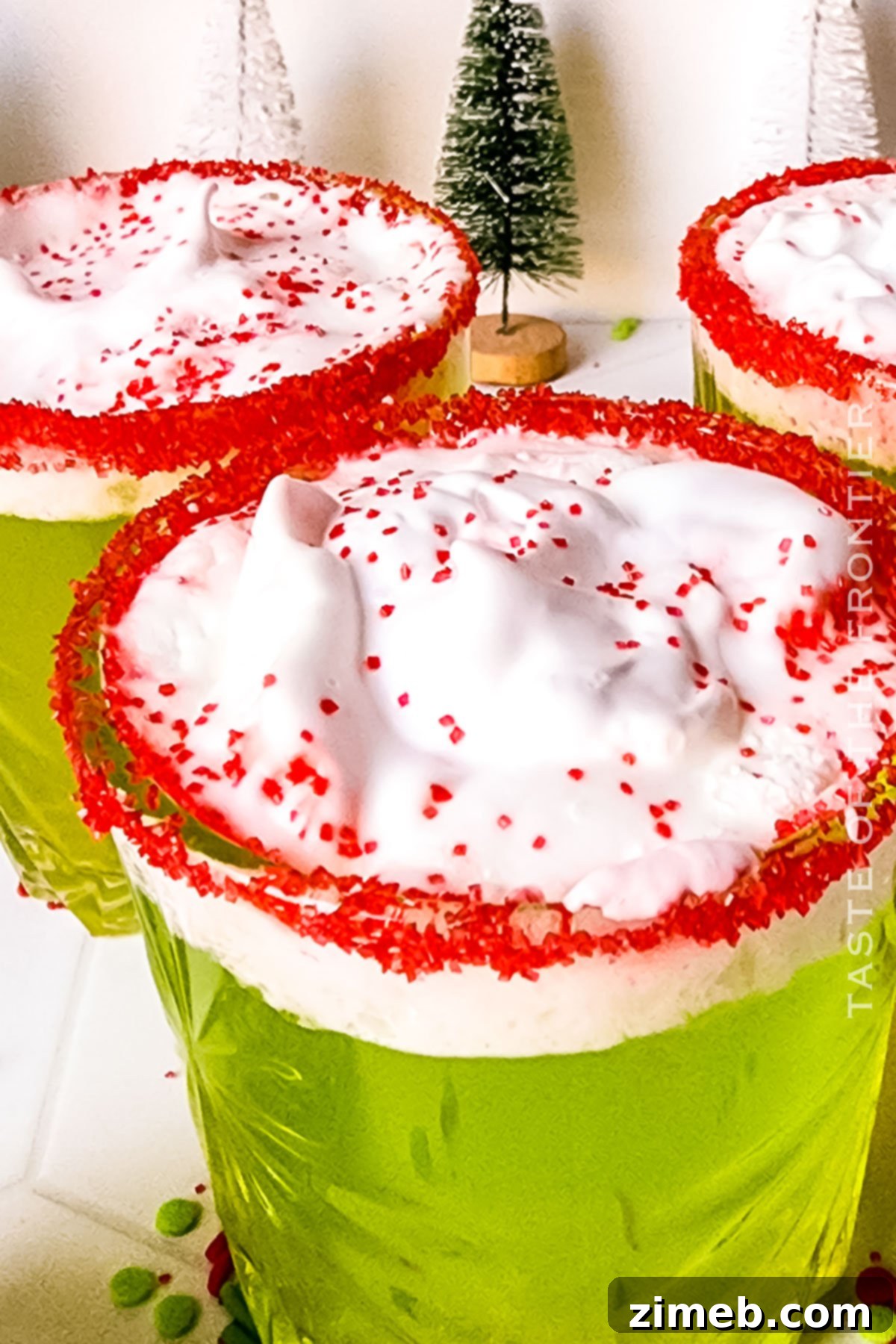 Grinch Cocktail and non-alcoholic Grinch Punch, a festive holiday drink