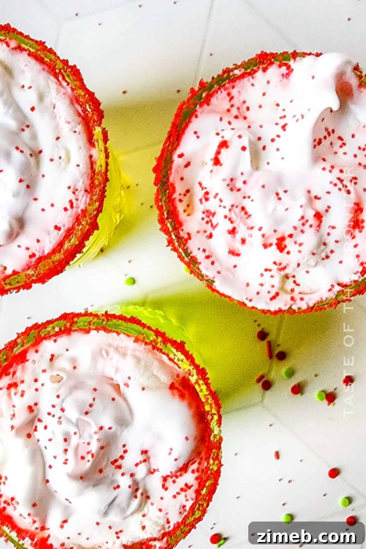 Whipped cream and cherry garnish on a holiday party drink