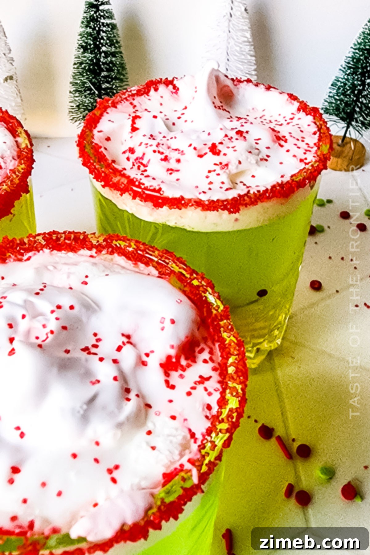 Non-alcoholic Grinch Punch in a festive glass
